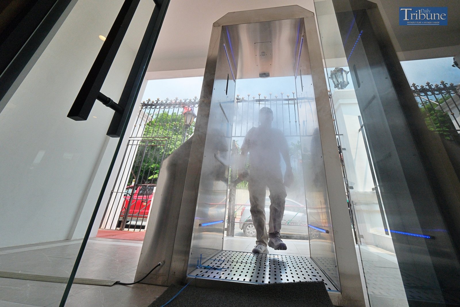 TRIBUNE-coviddisinfectiondoor